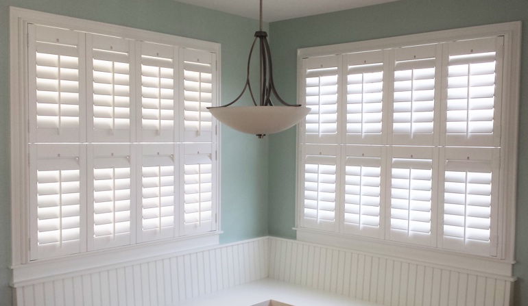 Soft green wall in Las Vegas kitchen with shutters.